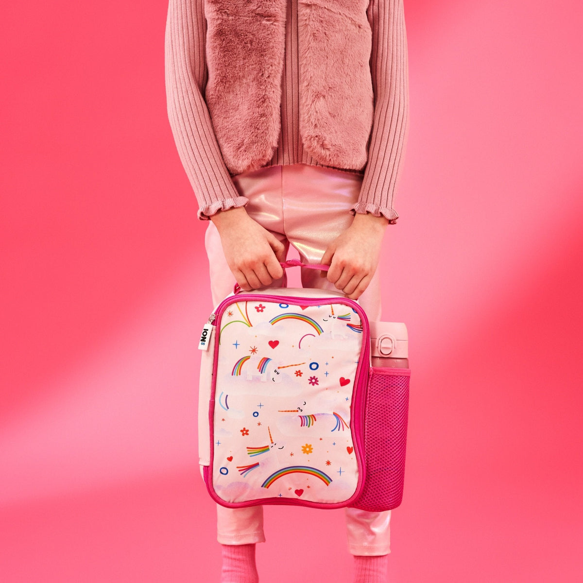 ION8 Unicorn Rainbows lunch bag and bottle set in use, carried by a child