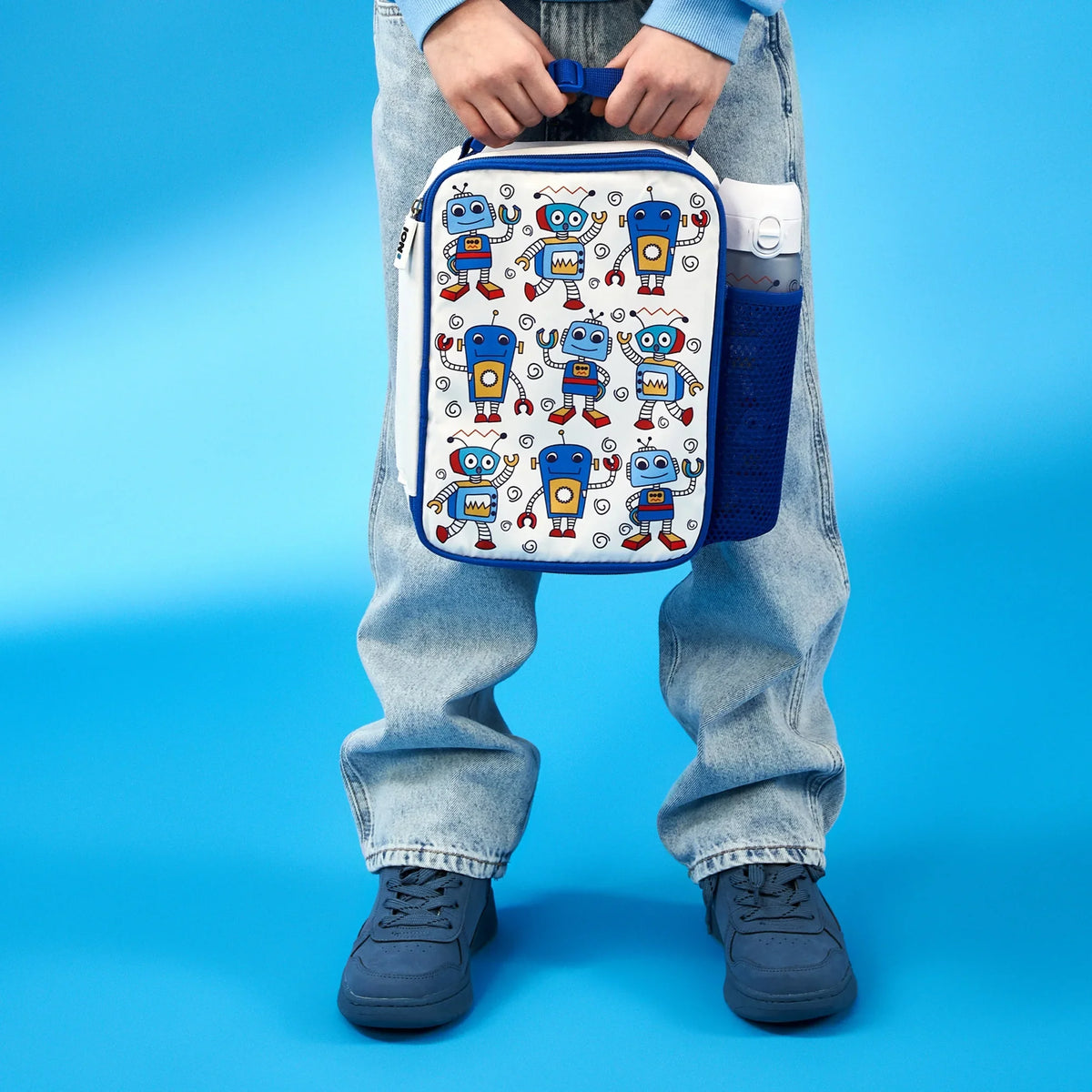 ION8 Robots lunch bag and bottle set in use, carried by a child