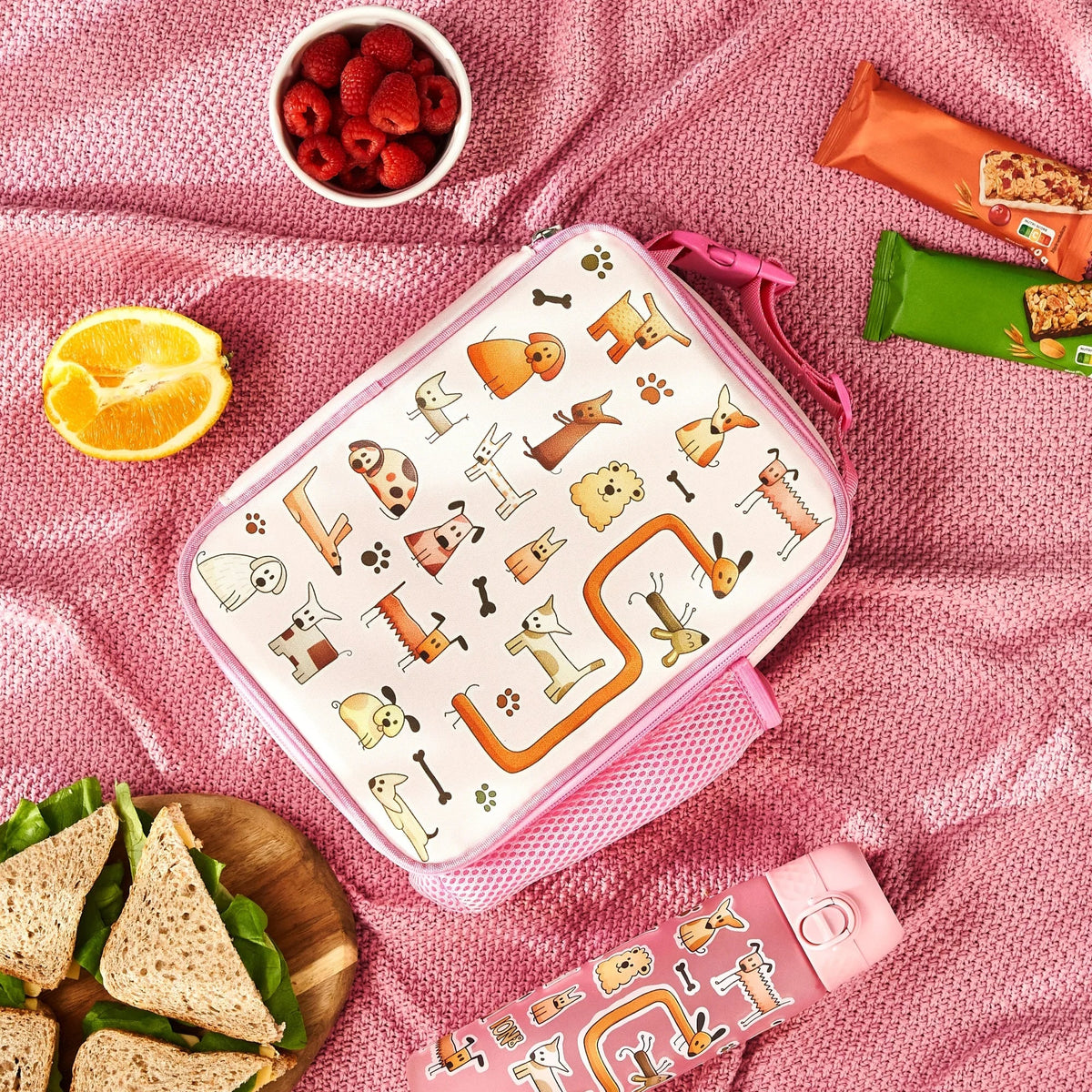 ION8 Dogs lunch bag and bottle set in use on a picnic