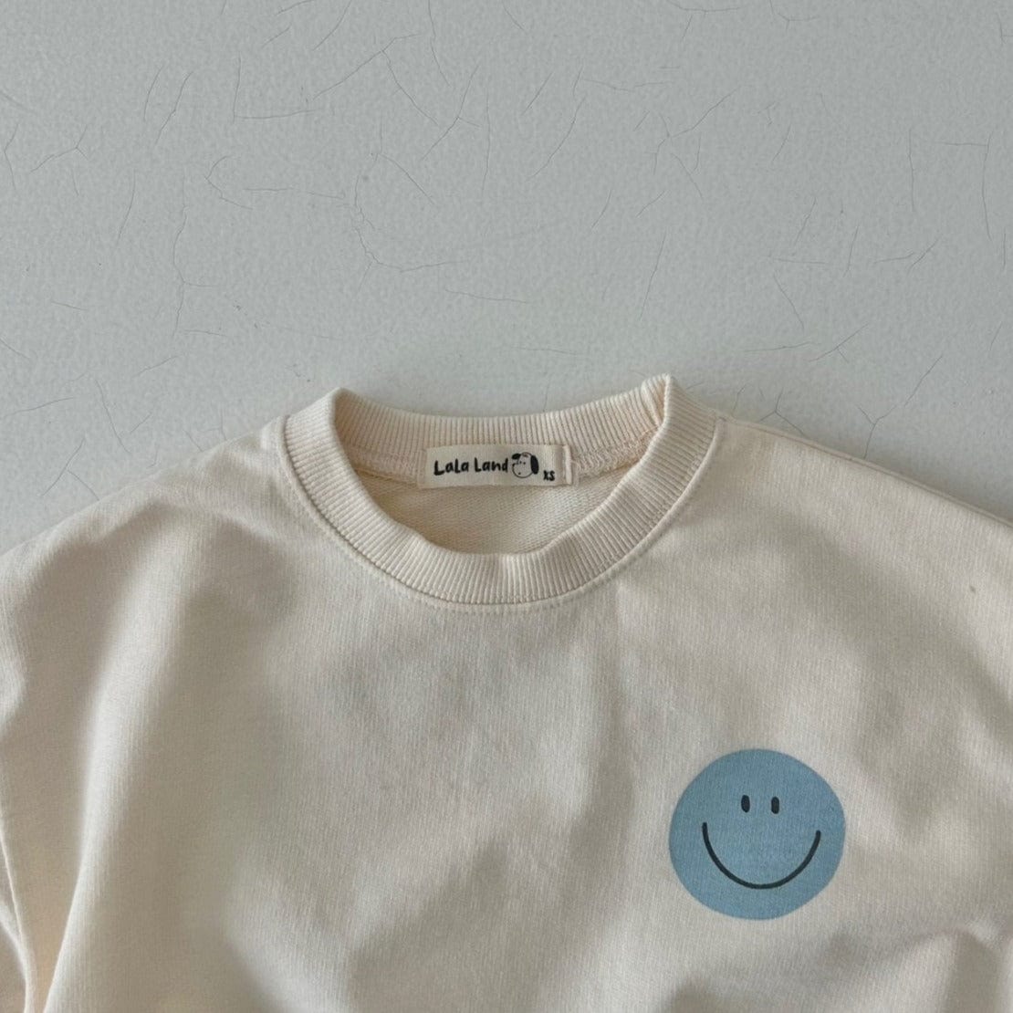 LALA Land Sweatshirt Unisex Cream Smile Sweatshirt