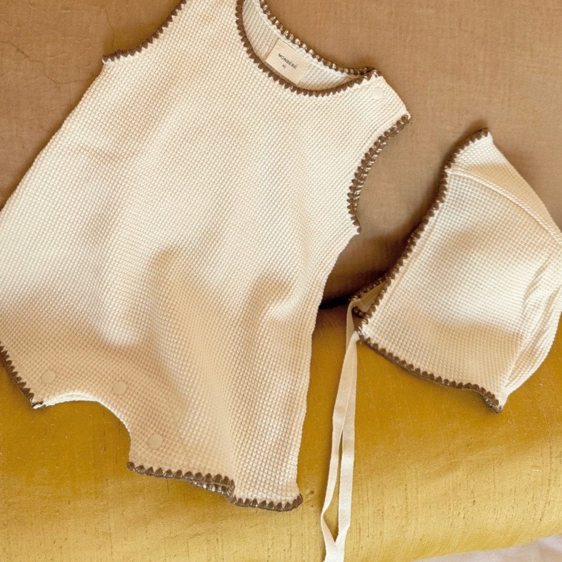 Monbebe Jumpsuit & Hat Summer Waffle Baby Jumpsuit + Hat Set (Cream with Brown Trim)