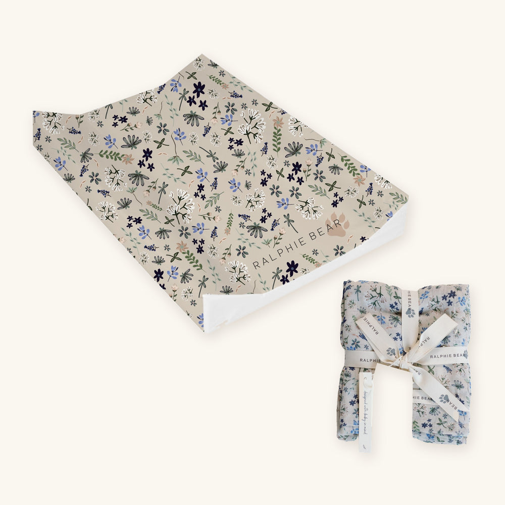 Wildflower Newborn Changing Set together: Ralphie Bear Wildflower anti-roll wedge changing mat and large swaddle muslin