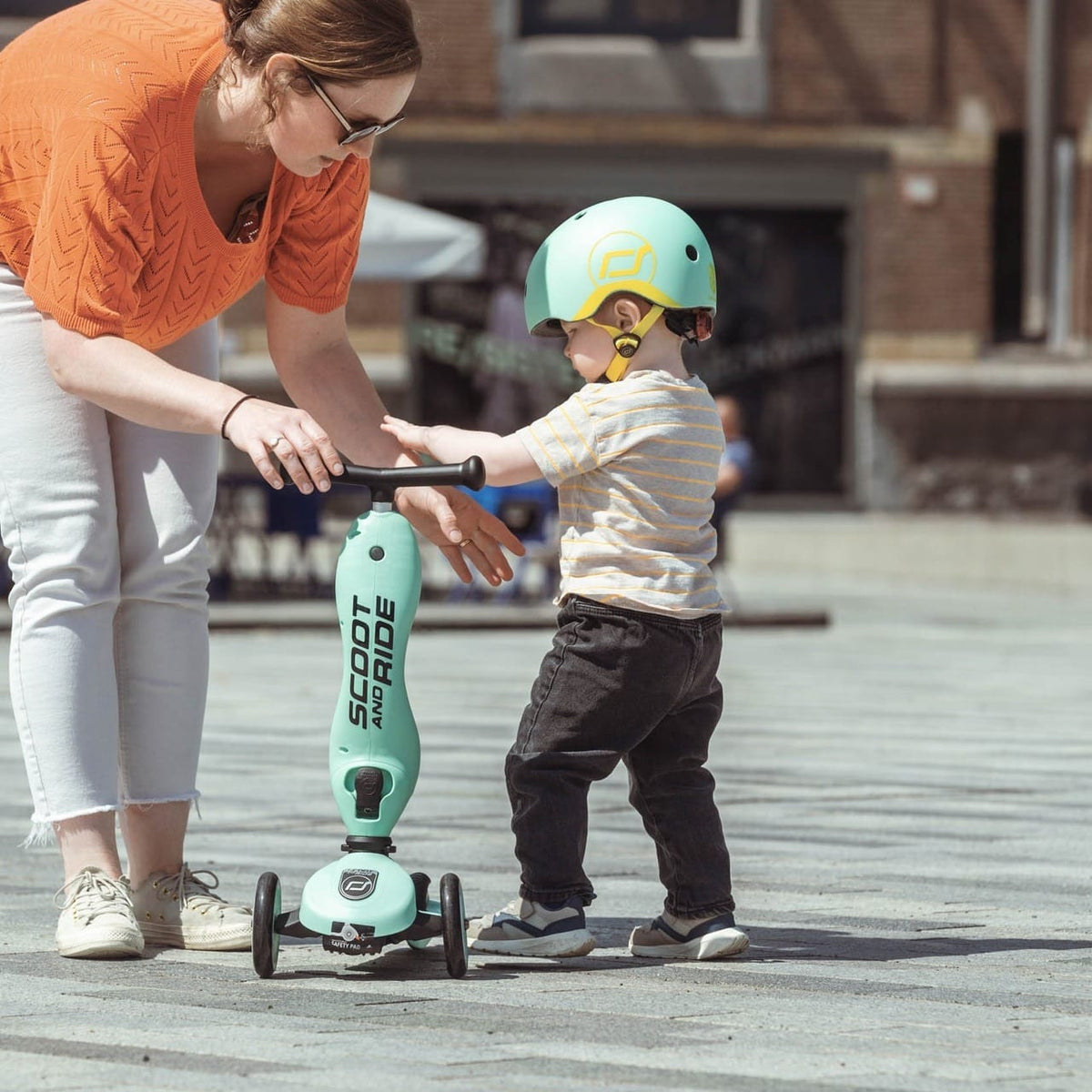 Scoot & Ride Highwaykick 1 Scooter - Kiwi – toddler riding with a parent