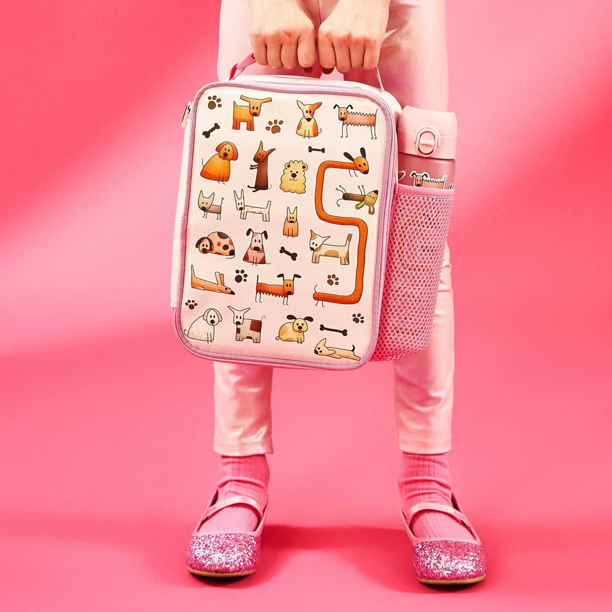 ION8 Dogs lunch bag and bottle set in use, carried by a child