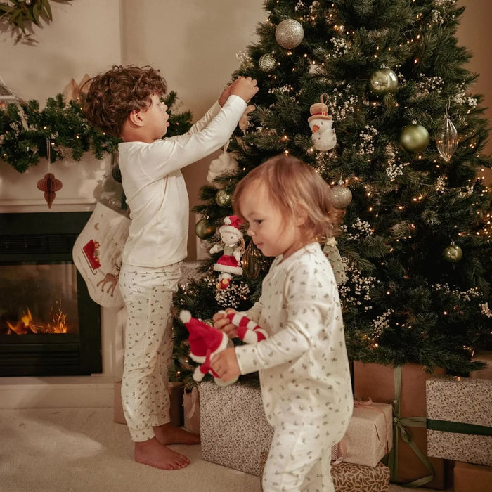 Two children decorating a Christmas tree with Little Dutch decorations