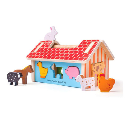 Bigjigs Wooden Farmhouse Shape Sorter with a red roof and eight colourful wooden farm animals