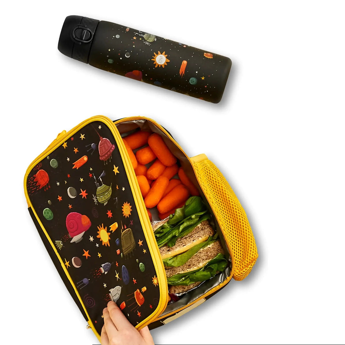 ION8 Spaceships insulated lunch bag open with a packed lunch, next to the matching spaceships water bottle