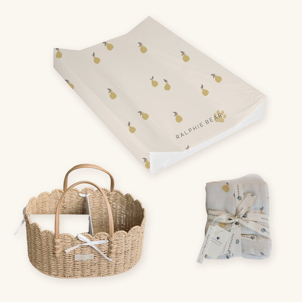 Pears Changing Station Set together: Ralphie Bear scallop edge nappy caddy basket, Pears anti-roll wedge changing mat and Pears large swaddle muslin