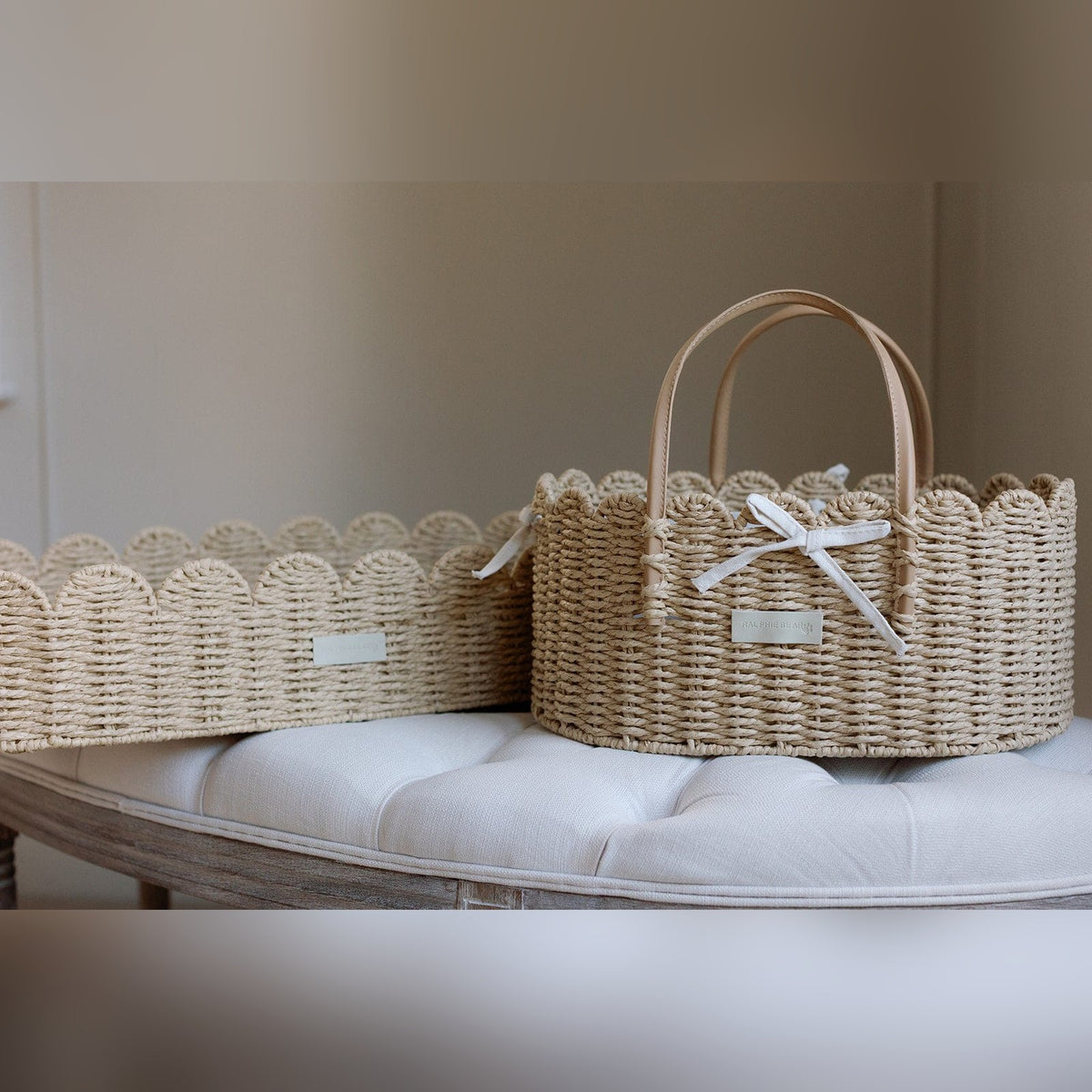 Two Ralphie Bear scallop edge baskets side by side in a nursery