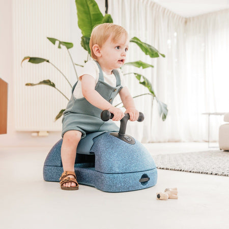 Scoot & Ride My First 3-in-1 walker in a cream living room
