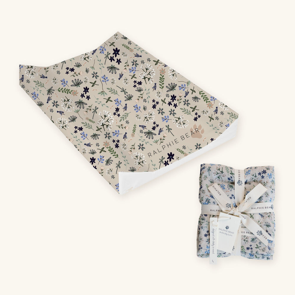 Wildflower Newborn Changing Set together: Ralphie Bear Wildflower anti-roll wedge changing mat and large swaddle muslin